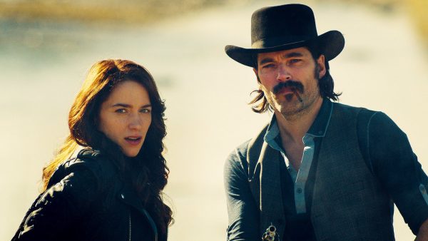 WYNONNA EARP -- "The Blade" Episode 104 -- Pictured: (l-r) Melanie Scrofano as Wynonna Earp, Tim Rozon as Doc Holliday -- (Photo by: Syfy/Wynonna Earp Productions)