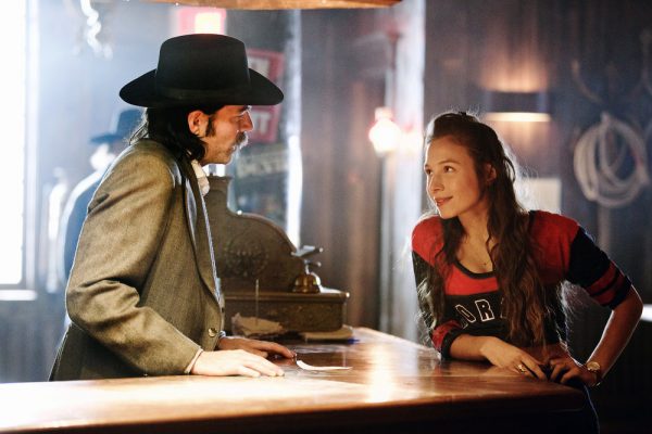 WYNONNA EARP -- "Keep the Home Fires Burning" Episode 102 -- Pictured: (l-r) Tim Rozon as Doc Holliday, Dominique Provost-Chalkley as Waverly Earp -- (Photo by: Michelle Faye/Syfy/Wynonna Earp Productions)